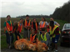 Junior Leaders pick up trash on Bueche Road during their Trash Bash event