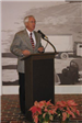 Man speaking during dedication at the podium