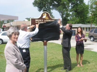 Historical marker being uncovered